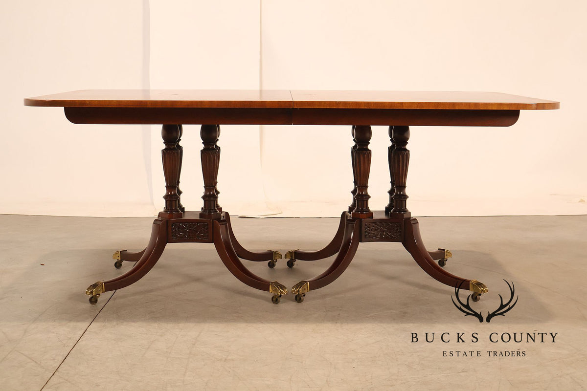 Baker Furniture Company Regency Style Mahogany Double Pedestal Dining Table With Satinwood Banding And Extension Leaves