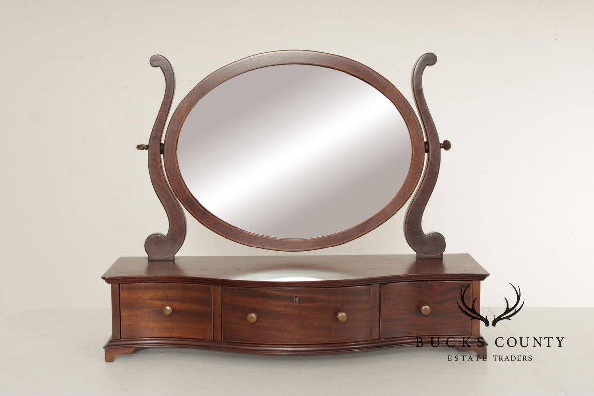 Potthast Bros. Federal Style Mahogany Shaving Mirror With Serpentine Base And Oval Swivel Glass