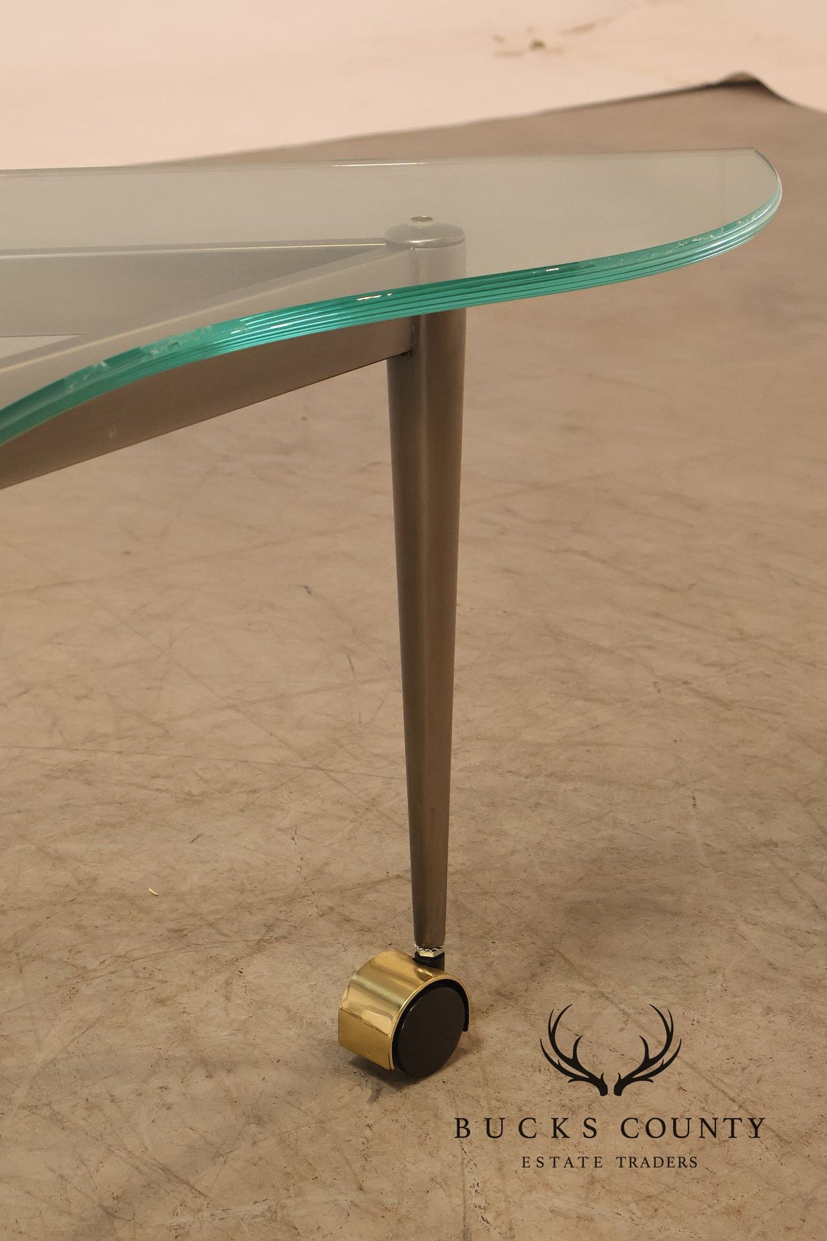 Postmodern Pair Of Triangular Glass Top Coffee Table with Brushed Steel Frame and Brass Casters
