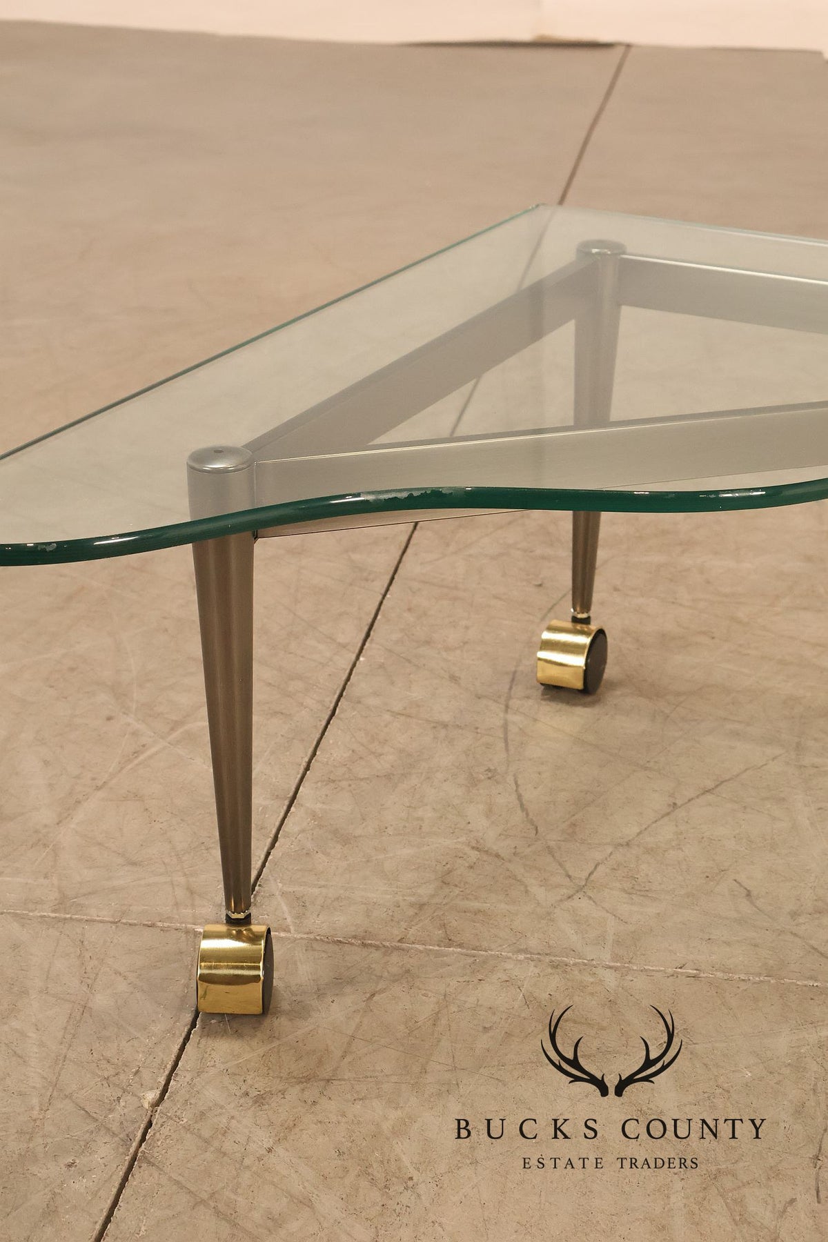 Postmodern Pair Of Triangular Glass Top Coffee Table with Brushed Steel Frame and Brass Casters